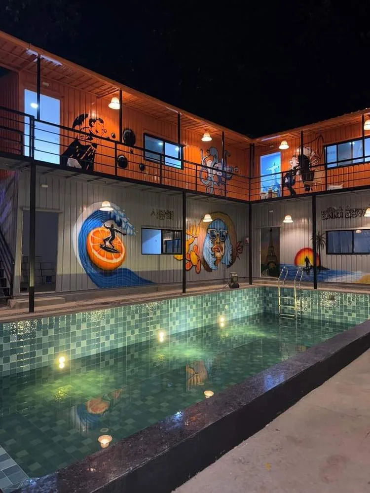 Outdoor pool and courtyard at night