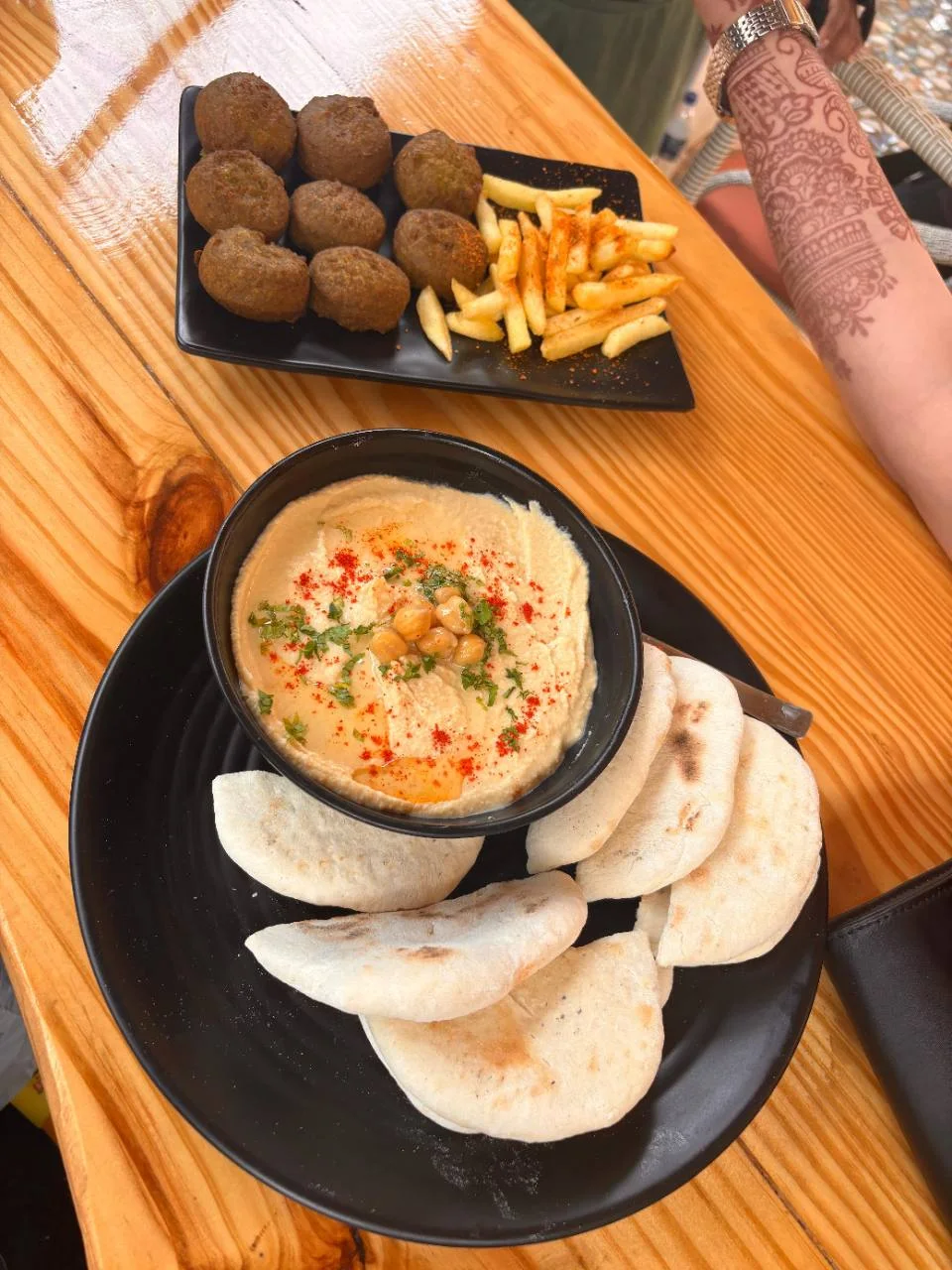 Hummus, pita bread and snacks served at the Half Orange cafe