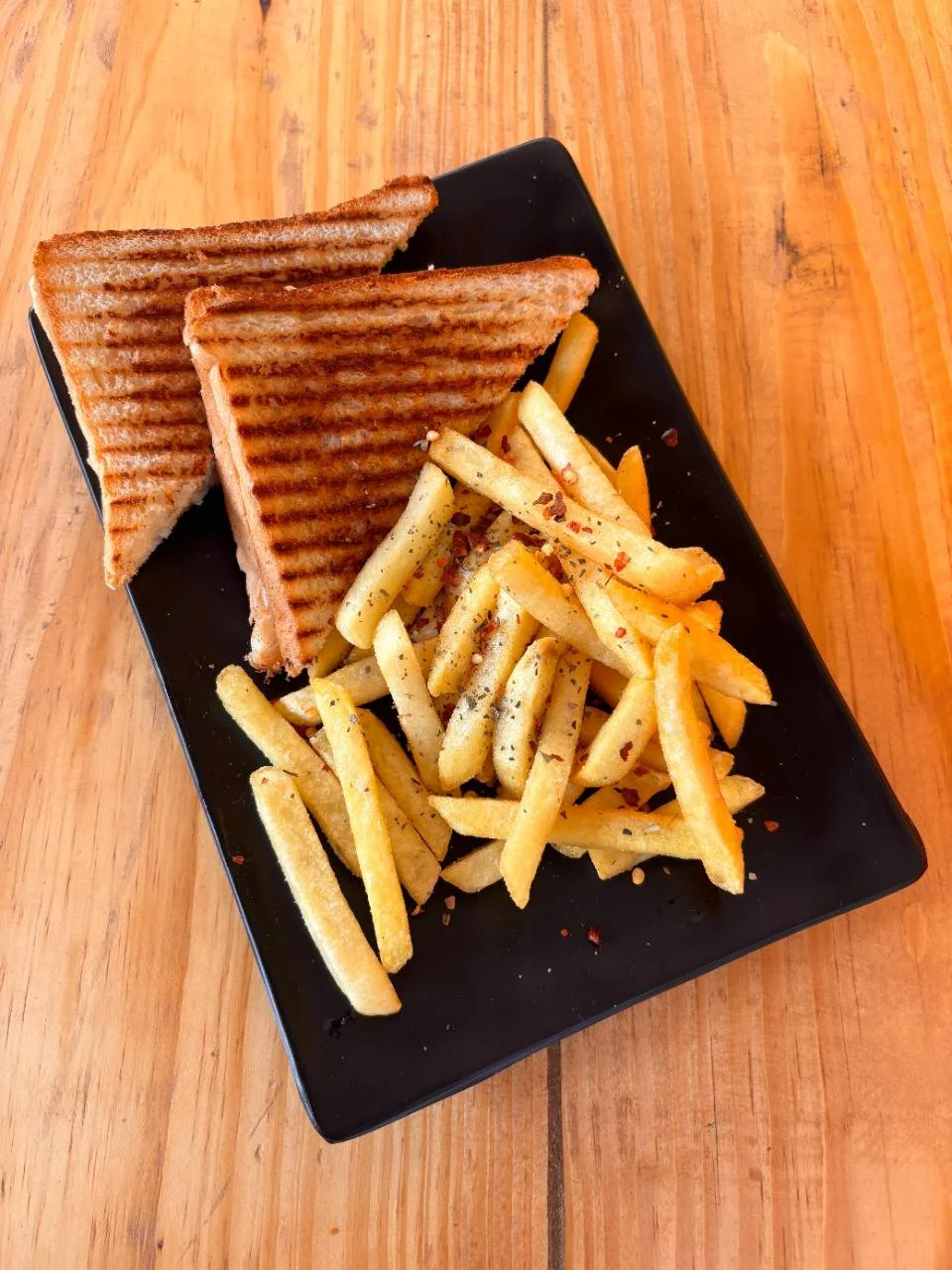 Grilled toasties and fries served at the Half Orange cafe
