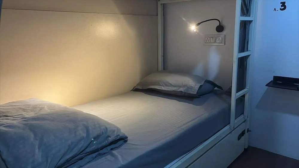 Pod-style dormitory beds at Half Orange Hostel