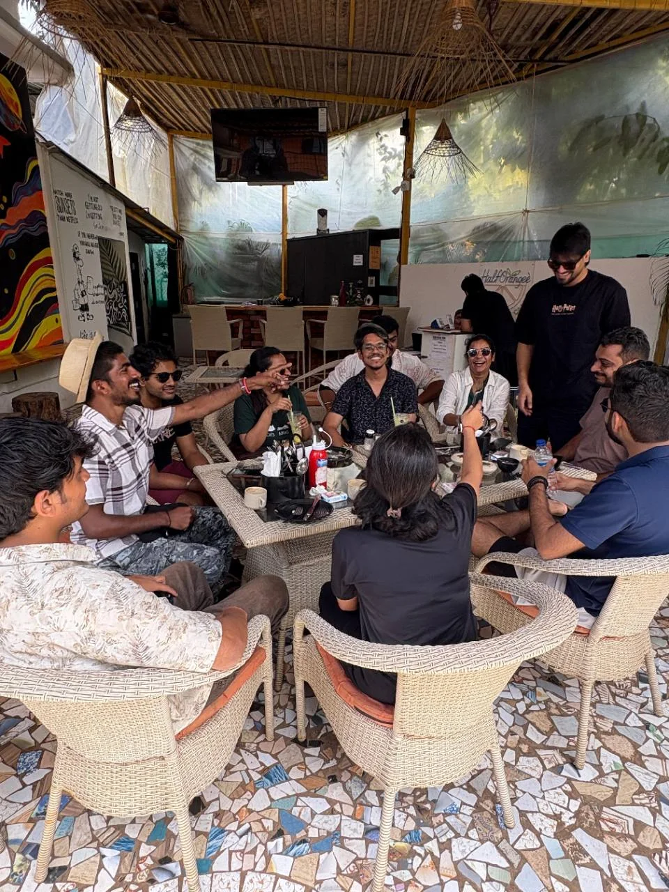 A group of travellers sharing a table in the Half Orange cafe